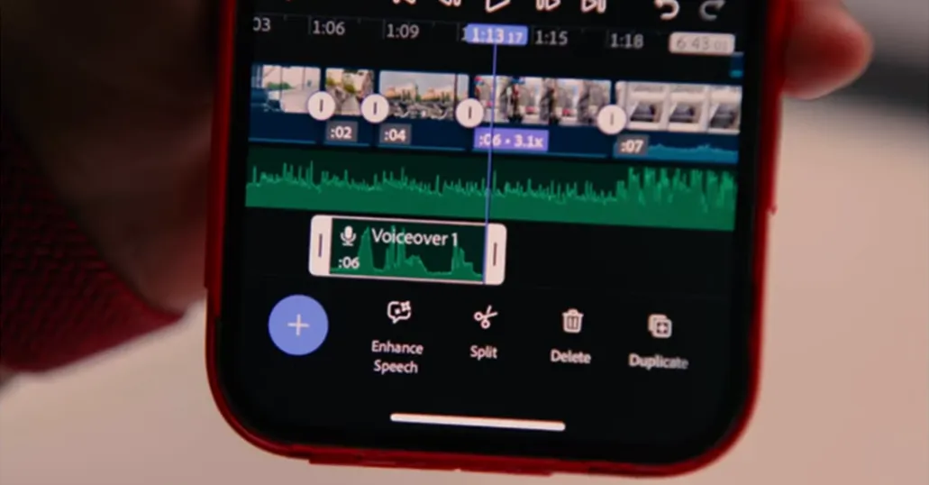Premiere Pro Mobile mobile video editor on iPhone with voiceover track selected and Enhance Speech, Split, Delete, Duplicate tools on the timeline.