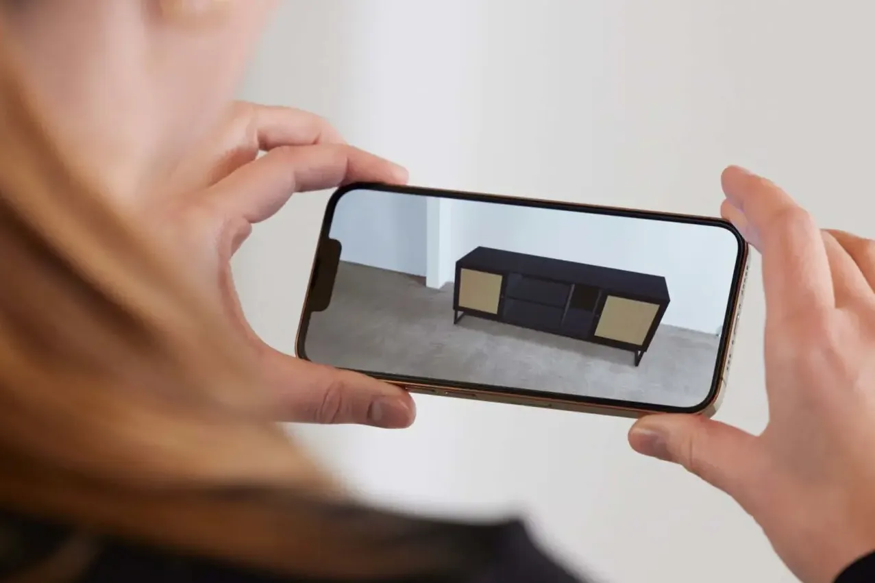 User scans QR code to load Adobe Aero AR experience on iPhone